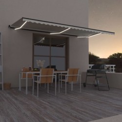 vidaXL Toldo retráctil manual con luz LED color crema 600x350 cm