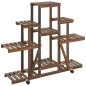 vidaXL Soporte de flores con ruedas madera maciza abeto 110x25x101 cm vidaXL Soporte de flores con ruedas madera maciza abeto 110x25x101 cm