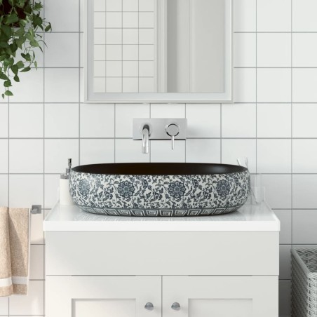 vidaXL Lavabo sobre encimera ovalado cerámica negro y azul 59x40x14 cm