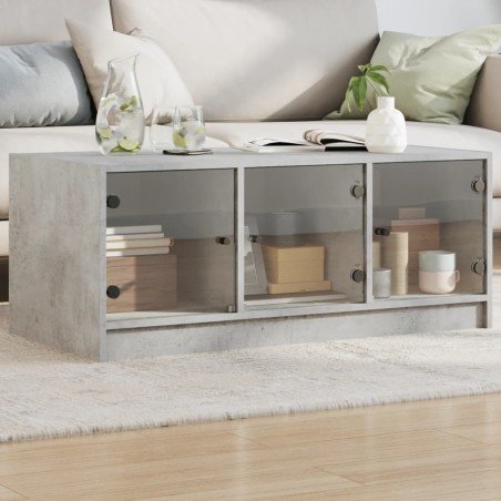 vidaXL Mesa de centro con puertas de vidrio grs hormigón 102x50x42 cm